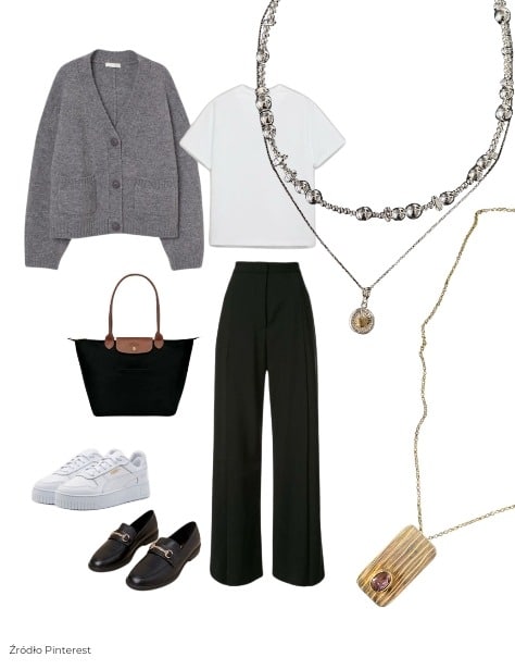 Złoty naszyjnik z prostokątnym wisiorkiem i różowym kamieniem w eleganckiej stylizacji z szarym kardiganem i czarnymi spodniami.